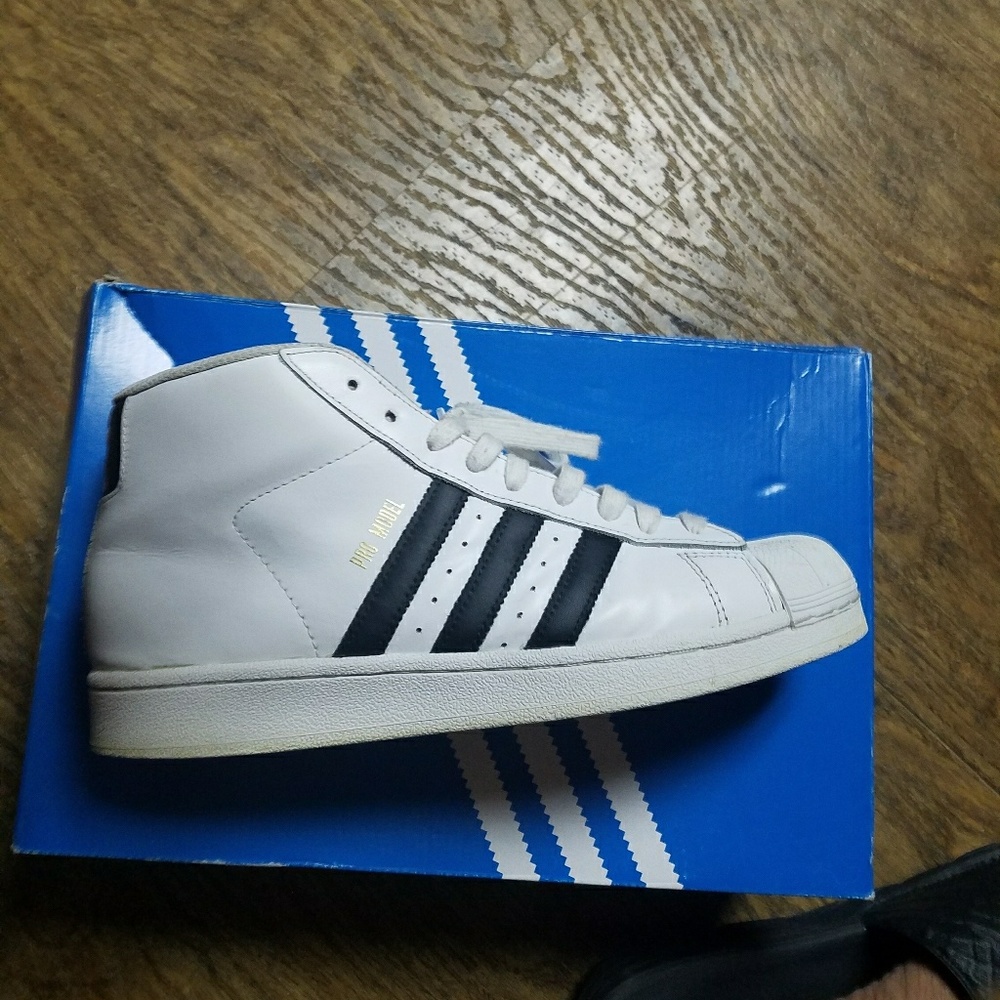 Black and white shell toe Adidas